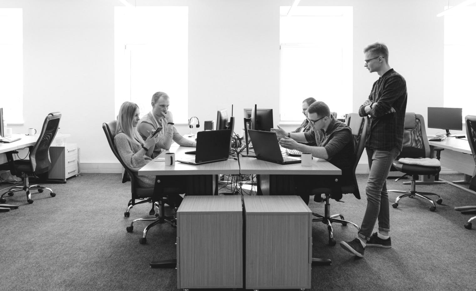 Professional trading analysis workspace with multiple monitors displaying market charts and technical indicators